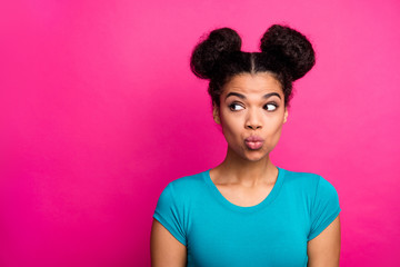 Poster - Closeup photo of beautiful pretty dark skin lady two buns hairdo look side empty space send air kiss tricky mood interested wear blue casual t-shirt isolated vivid pink color background