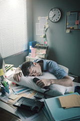 Wall Mural - Businessman sleeping in the office overnight