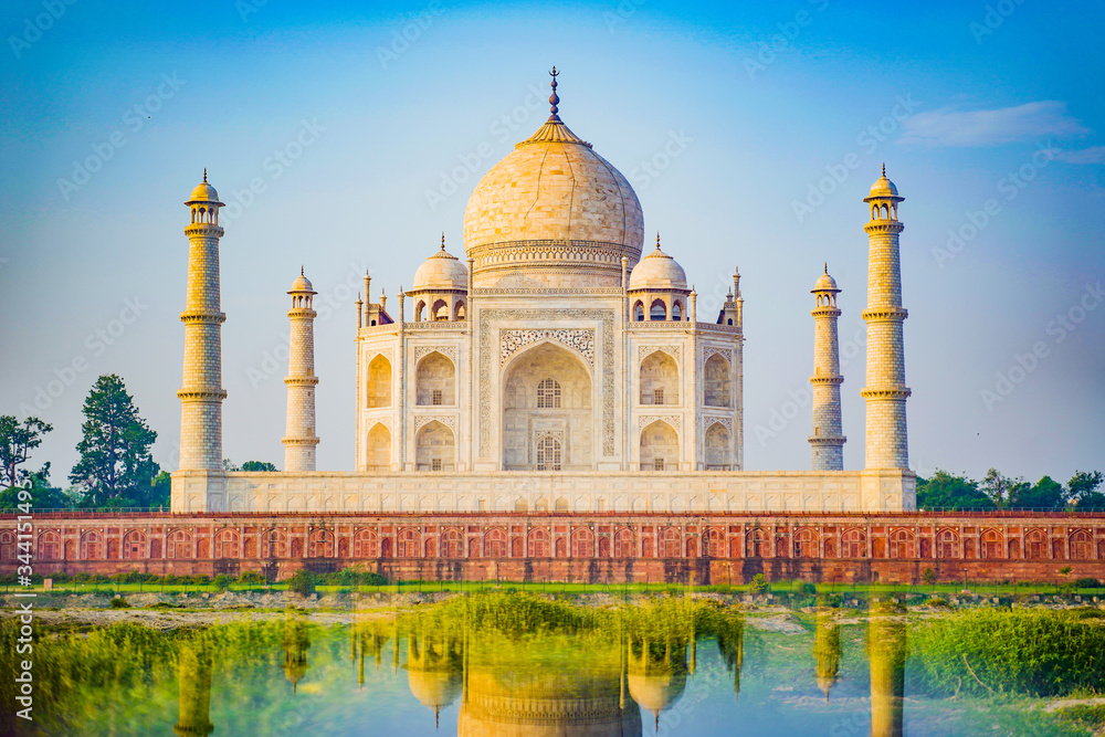 the-taj-mahal-is-an-ivory-white-marble-mausoleum-on-the-south-bank-of