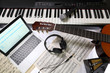 © AlexZlat - equipment for recording music in the studio, piano, guitar, microphone, headphones, laptop