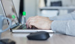 © Тоня Коренева - Coronavirus. Man working from home using sanitizer. Quarantine and self-isolation with work from home office. Working from home. Cleaning her hands with sanitizer gel.