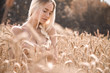 Belarusian blonde girl posing on the field of wheat so pretty and so beautiful and naked in nature