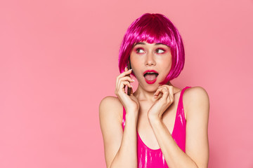 Poster - Image of young beautiful girl wearing wig talking on cellphone