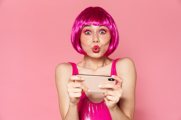 Poster - Image of happy girl wearing wig playing video games on cellphone