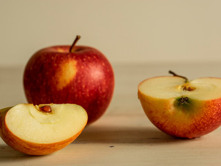 an apple and two pieces of apple