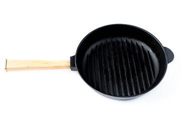 cast iron black pan with ribs on a white background, isolate