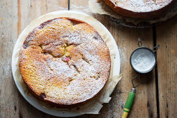 Wall Mural - Orange cake with raspberries and rhubarb cut into pieces 