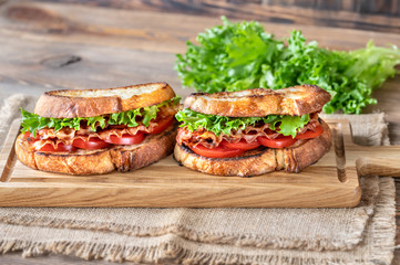 Wall Mural - BLT sandwiches on the wooden board