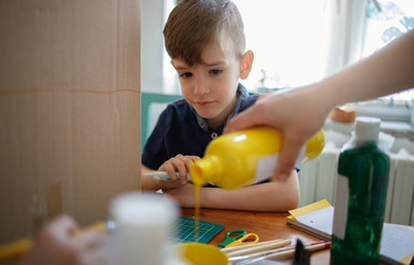 Sticker - Boy playing with colours at home