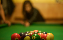 Close-up Of Cue Balls On Pool Table