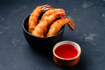 Wall Mural - Fried rolls with prawns, served with sweet chili sauce on Dark background