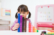 © M-image - toddler girl play number blocks for homeschooling