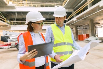 Two business builder people at construction site