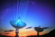 © ktsdesign - Huge satellite antenna dish for communication and signal reception out of the planet Earth. Observatory searching for radio signal in space at sunset.