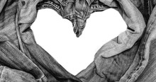 Directly Above Jeans Arranged In Heart Shape On White Background