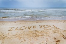 High Angle View Of I Love You Message On Sandy Beach
