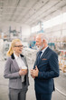 © JustLife - Man and woman discussing work