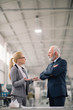 © JustLife - Man and woman discussing work
