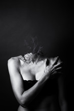 Conceptual Monochrome Image Of A Woman Who Lost Head In A Puff Of Smoke
