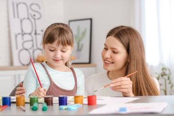 Sticker - Drawing teacher giving private art lessons to little girl at home