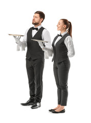 Male and female waiters on white background