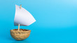 a small boat made of nutshell with a white sail on the blue background. Journey banner template.