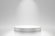 White studio template and round shape pedestal on simple background with spotlight product shelf. Blank studio podium for advertising. 3D rendering.
