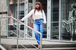 © AS Photo Family - Cute african american model in white shirt and jeans pants posed outdoor.