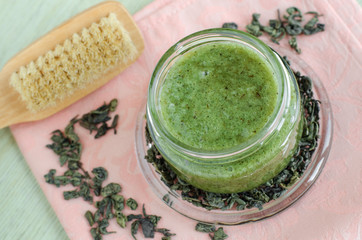 Homemade natural mask (scrub, foot soak) with sea salt, olive oil and green tea. Diy cosmetics recipe. Top view, copy space