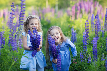 two girls laughing in purple flowers