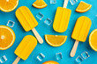 Ice lollies with orange flavour and ice cubes