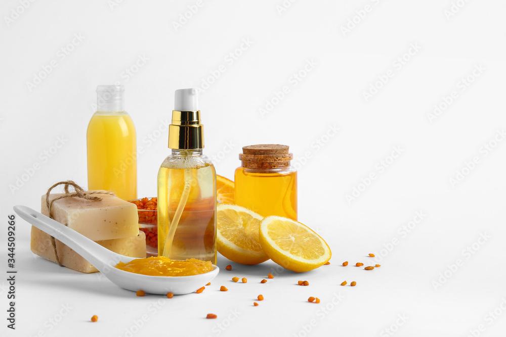 Natural cosmetics with ingredients on white background