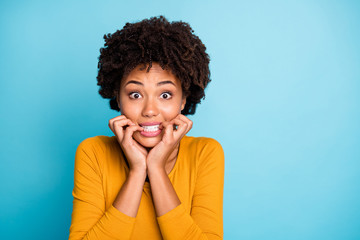 Wall Mural - Close up photo of frustrated sad fear afro american girl hear horrible her job mistake news bite nails teeth wear good look sweater isolated over blue color background