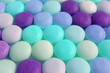 Row of Aqua Blue and Purple Color Tone Round Shaped Candies for Background or Banner	