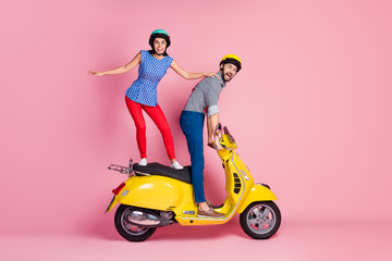 Poster - Full size profile side photo of positive cheerful two people bikers stand on funky motor bike drive fast speed enjoy road adventure scream wow omg isolated over pastel color background