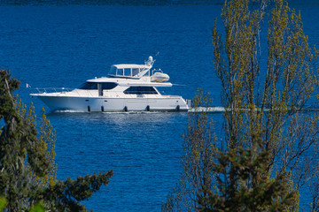 Sticker - 2020-04-29 A LARGE WHITE YACHT SURROUNDED BY EVERGREENS ON LAKE WASHINGTON BY MERCER ISLAND