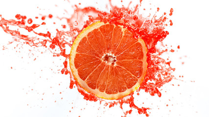 Wall Mural - Freeze motion of sliced grapefruit with splashing juice isolated on white background