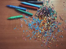 Directly Above View Of Colorful Crayon Shavings On Table