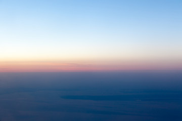 Wall Mural - Sunset landscape view of the coast from the plane.