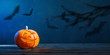© Maya Kruchancova - Halloween pumpkin on dark blue  background