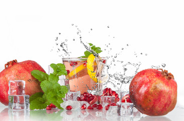 Wall Mural - summer pomegranate drink with lemon and mint with splashed water and ice