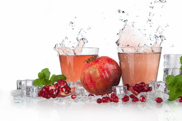 Wall Mural - summer pomegranate drink with lemon and mint with splashed water and ice