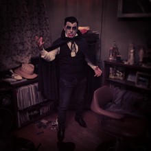 Portrait Of Young Man In Vampire Costume Standing At Home During Halloween