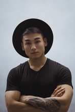 Fashion Asian Man Portrait In Black Clothes