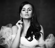 © Dmitry Lobanov - Portrait of young beautiful brunette woman in white sleeveless vintage dress with unusual decoration and earrings