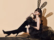 © Dmitry Lobanov - Young beautiful brunette woman in black high boots, sexy transparent cloth and lace rabbit ears and mask