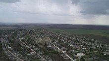 A Drone Is Flying Over A Village In Moldova And Filmed Rain Falling From The Clouds In The Distance