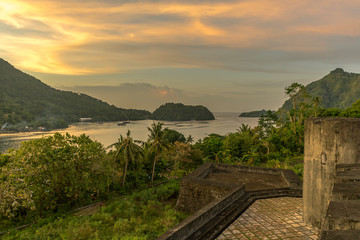 Fort Belgica scene in the evening and Gunung Api volcano are two landmark places in Banda islands, Maluku, Indonesia