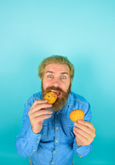 Cookie. Biscuit. Biscuits. Sweet snack. Man eats cookie. Homemade cookies. Taste of childhood. Bearded man with cookies. Breakfast or lunch. Sweet cookies. Bakery.