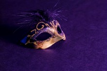 High Angle View Of Venetian Mask On Purple Background
